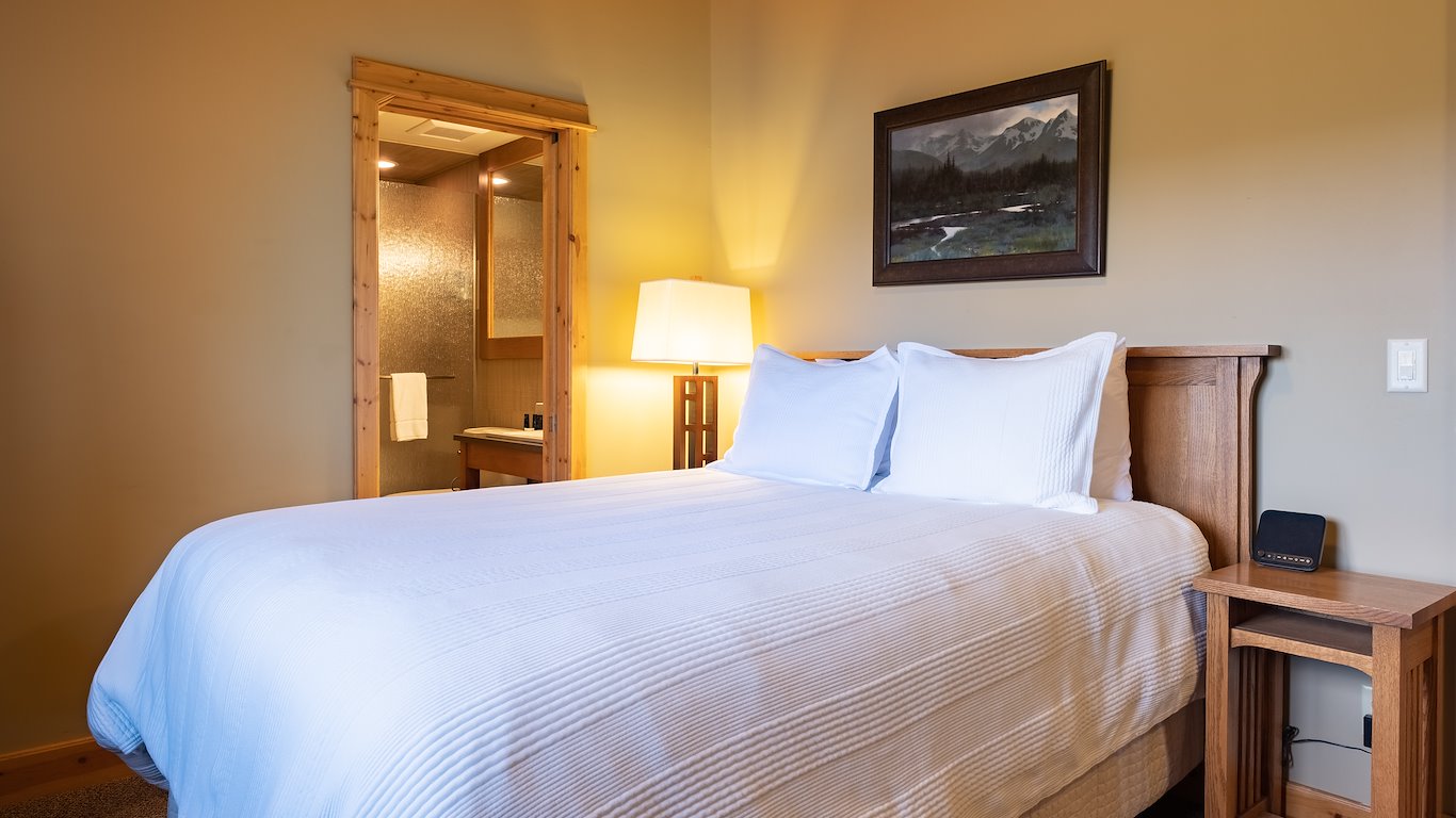 Cozy bedroom with bed and bathroom view