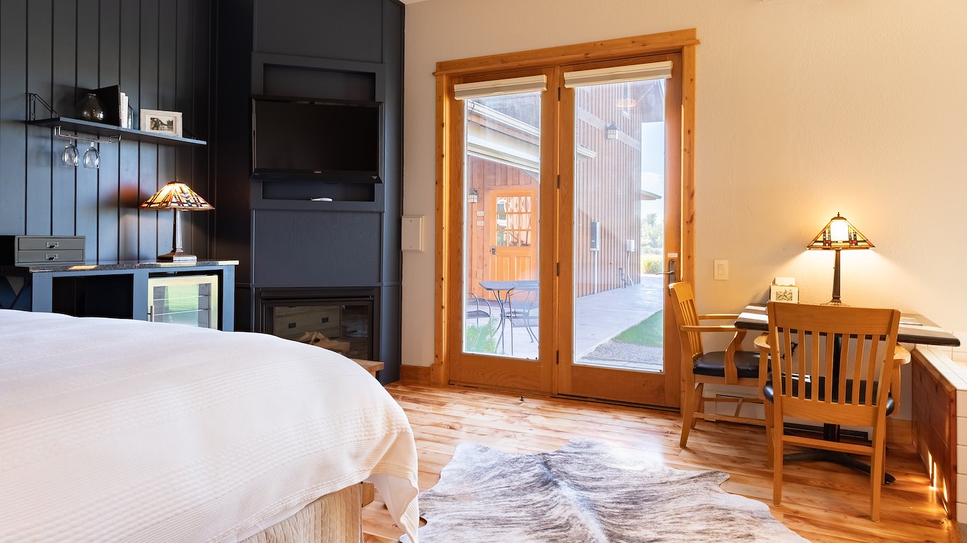 Cozy bedroom with wooden decor and natural light.