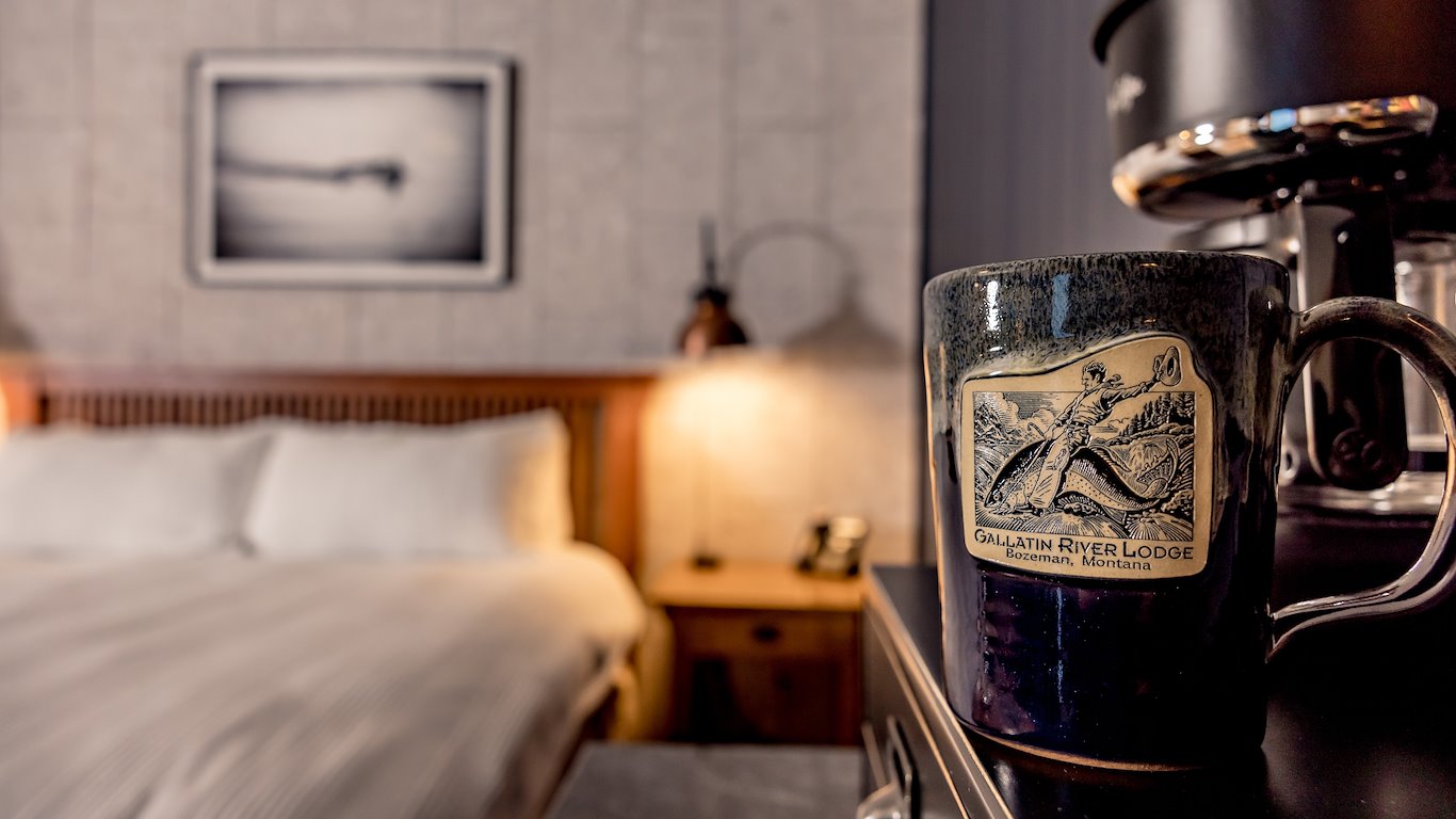 Ceramic mug on nightstand in cozy bedroom