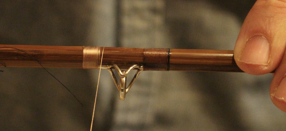 Close-up of fishing rod repair and assembly