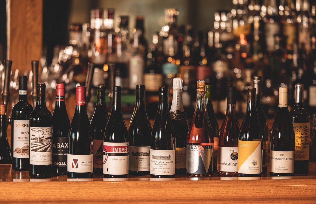 Assorted wine bottles on bar counter